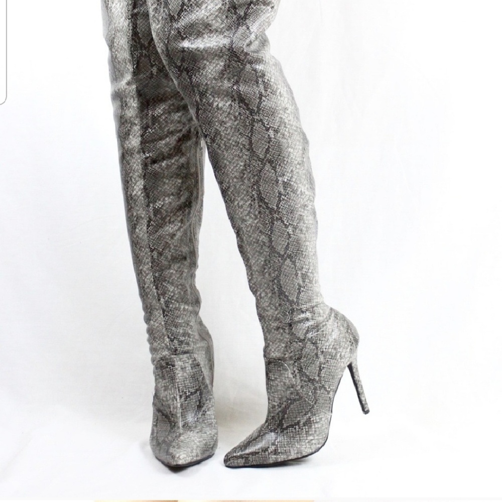 Thigh high snakeskin boots